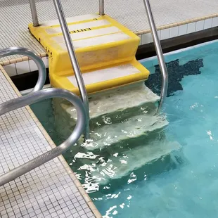 Dirty stairs leading into the pool