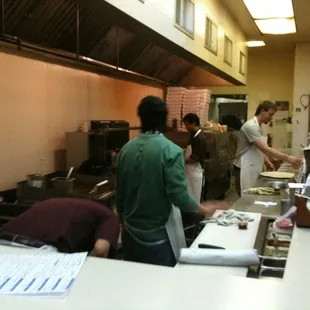 people working in a kitchen