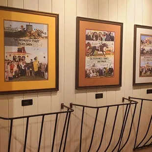 4'21'2022 Hallway decor displaying different horse racing photos.
