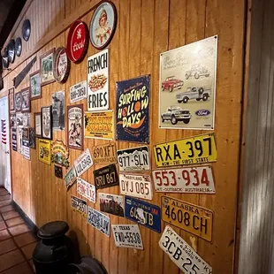 a wooden wall covered in stickers
