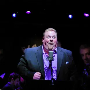 a man speaking into a microphone