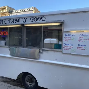 a food truck parked on the side of the road