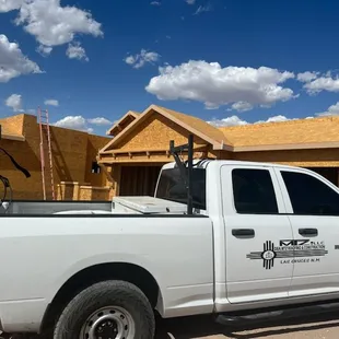 a truck parked in front of a house