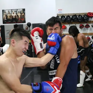 We spar technically and safely. No injuries after this photo. Mouthguard required to protect those teeth.