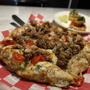 The Camila - garlic butter, fried chicken, peppadew peppers, agrodolce and mozzarella.  Delicious.