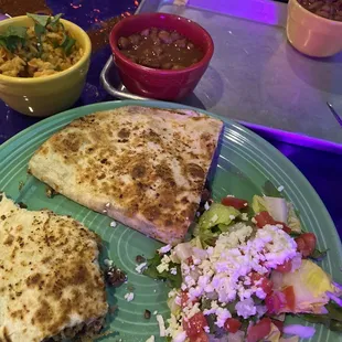 a plate of food and a bowl of salad