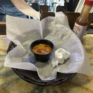 The remnants of a basket of chips, guac, 3 tacos, 5 drinks.