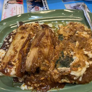 a plate of food with meat and rice