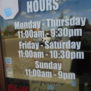 Hours of operation, front entry door.