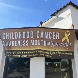 a sign for childhood cancer awareness month