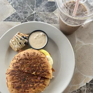 a plate of food and a cup of coffee