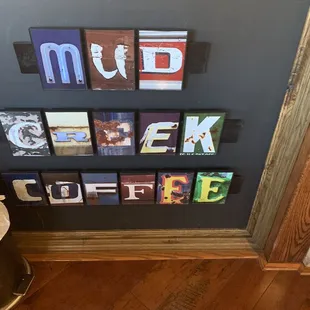 the word mud creek on the wall