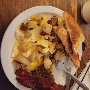 The Mud Street breakfast, so yummy. 2 eggs, potatoes, sausage or bacon and toast.