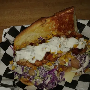 Bacon wrapped jumbo shrimp, lemon pepper slaw and topped with a smoked corn and andouille relish. Finished with a creamy horse radish.