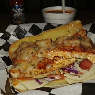 Cajun dusted swordfish, served over a roasted sweet pepper and basil infused slaw.  Topped with a shrimp scampi sauce.