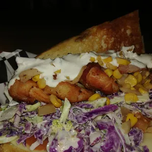 Bacon wrapped jumbo shrimp, lemon pepper slaw and topped with a smoked corn and andouille relish. Finished with a creamy horse radish.