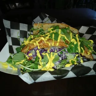 Cajun dusted swordfish (sword removed) and shrimp served over lemon pepper slaw. Topped with fresh watercress and a Saffron Creme Fraiche