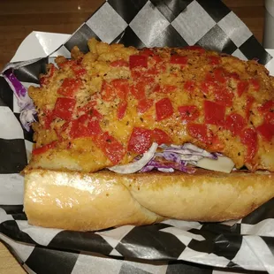 Pan seared skate wing served over truffled broccoli slaw. Topped with a Cajun Parmesan and roasted sweet pepper compound butter.