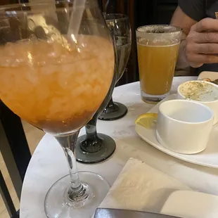 Orange drink that is supposed to prepare your stomach prior to eating.