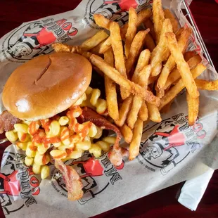 a burger and french fries on a table