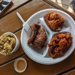 Saucy ribs, chicken thighs, bbq potatos and dressing with gravy.