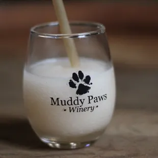 a glass of milk with a straw