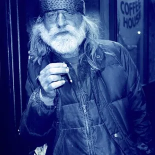 Man in front of Muddy Waters Coffee house, photo copyright Cynthia Brooks