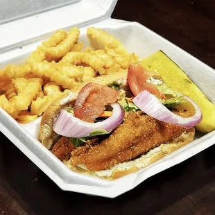 a meal in a styrofoam container