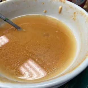 a bowl of soup with a spoon in it