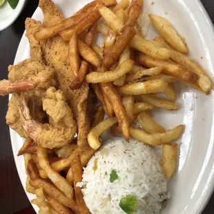 a plate of fried shrimp and french fries