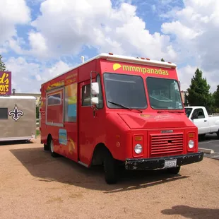 a man standing in front of a food truck