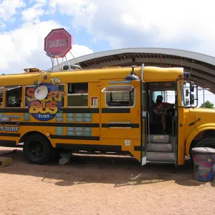 a yellow school bus parked in a parking lot