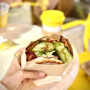 Cucumber, Za'atar seasoning, tomato, feta whip, bacon and egg, mint on an English muffin!  DELISH!  Horchata coffee in the background.