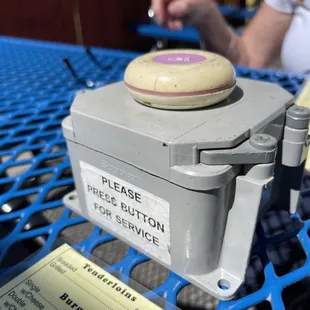 Outdoor dining - push button for service.