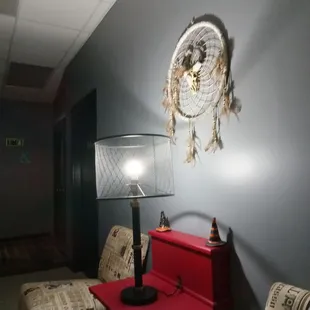 a red table with a lamp on it