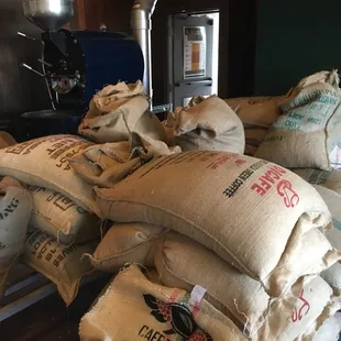 a pile of bags of coffee