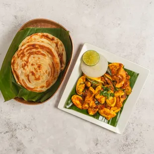a plate of food and a plate of flatbreads