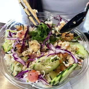 Medium salmon and tuna poke bowl with all the toppings.