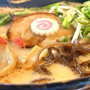 a bowl of ramen and chopsticks