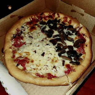 Half Onion And Half Mushroom Pizza. About $14.  It&apos;s Like A Step Down From DiGiornio.