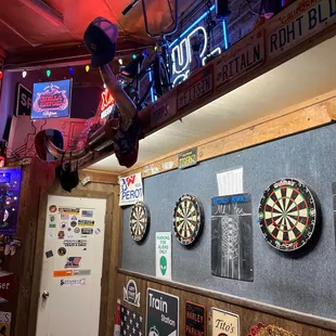 darts and neon signs