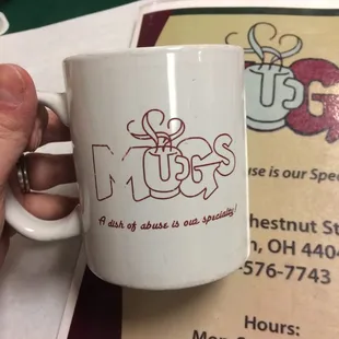 a person holding a coffee mug