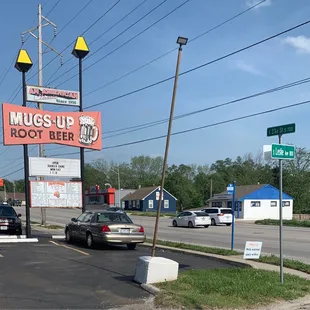 a mugs up root beer sign