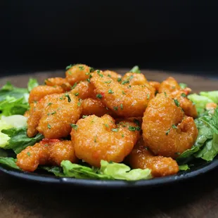 a plate of shrimp and lettuce