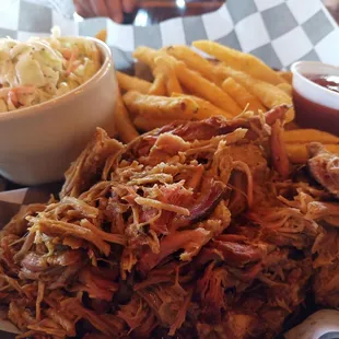 Pulled pork, fries, and cole slaw.