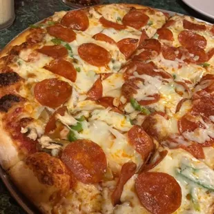 a pepperoni pizza on a table