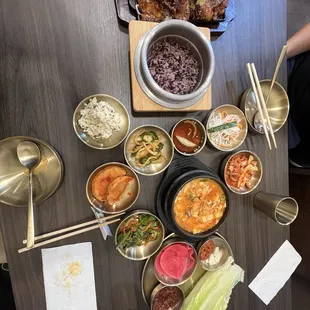 Purple rice, spiced pork, combo spicy kimchi soup, sides.