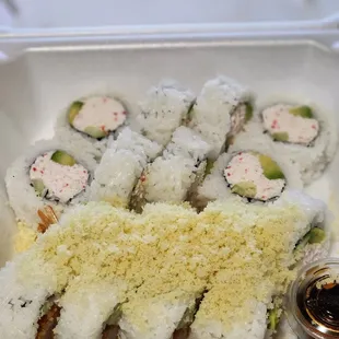 a close up of a tray of sushi