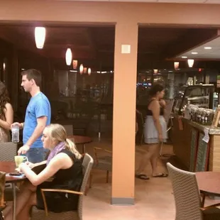 a group of people in a coffee shop