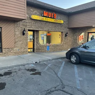 a car parked in front of the store
